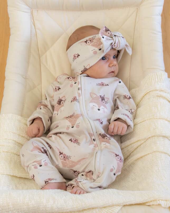 Baby wearing comfortable organic cotton romper with woodland fox design
