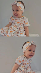 Baby girl wearing Wild Team organic cotton bow accessory brand Duper DuDu designd by a nicu nurse