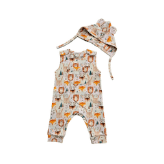 Baby wearing cute organic cotton hat with animal ears and ties