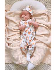 Baby wearing Wild Team organic long leg romper and matching bonnet brand Duper DuDu design by a NICU nurse