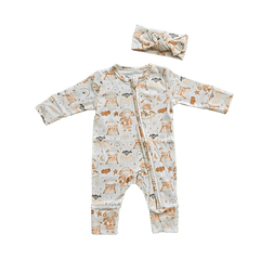 Baby wearing neutral organic cotton sheep print bow brand Duper DuDu design by a NICU nurse