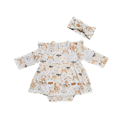 Baby wearing neutral organic cotton sheep print bow brand Duper DuDu design by a NICU nurse