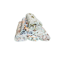 Stack of rolled organic cotton baby swaddles including Little Sheep design brand Duper DuDu design by a NICU nurse