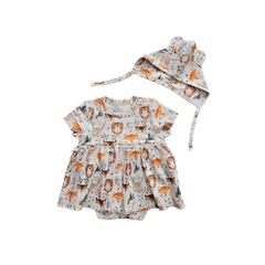 Flat lay of Wild Team organic cotton baby dress onesie brand Duper DuDu design by a NICU nurse