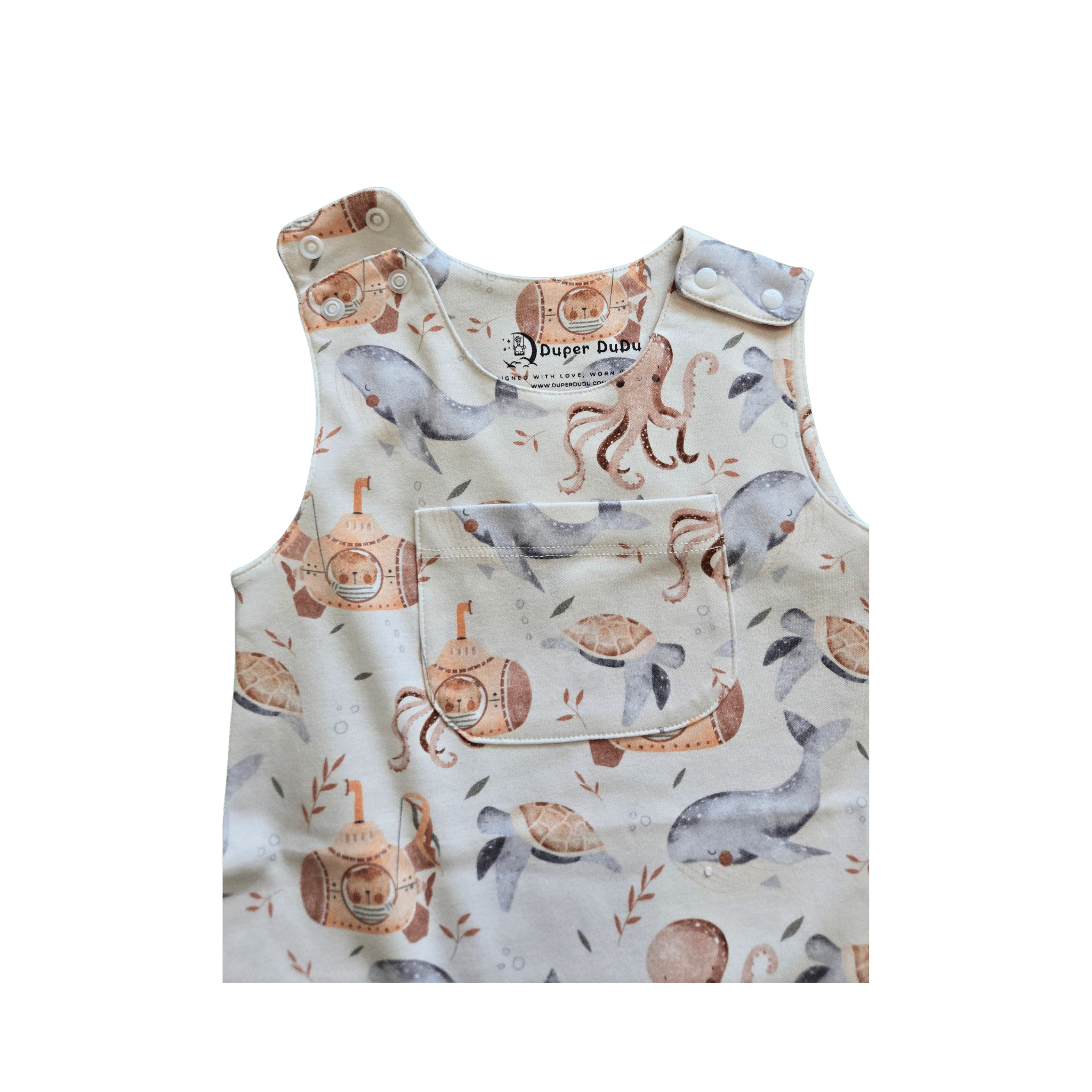 Close up of snap buttons on Sea Me organic summer baby romper