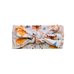 Organic cotton baby headband with safari animal print featuring bears and foxes