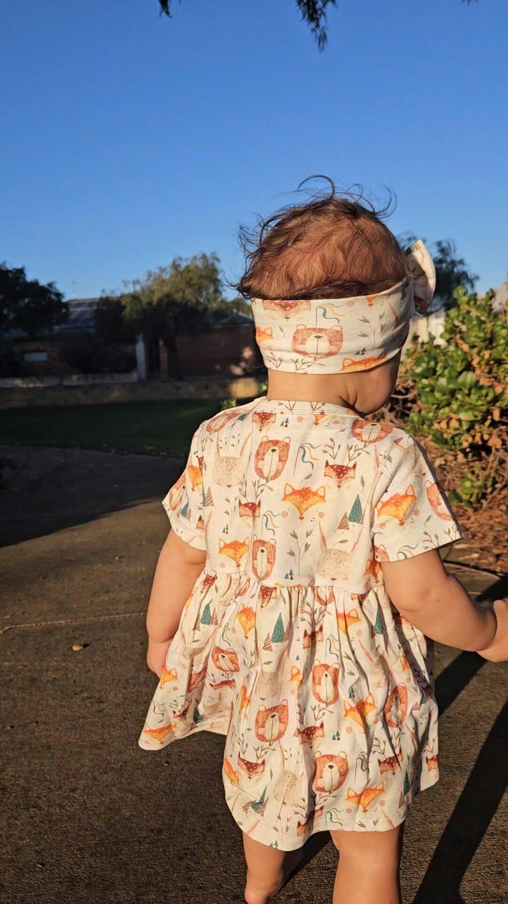 Baby girl wearing Wild Team organic safari dress onesie brand Duper DuDu design by a NICU nurse