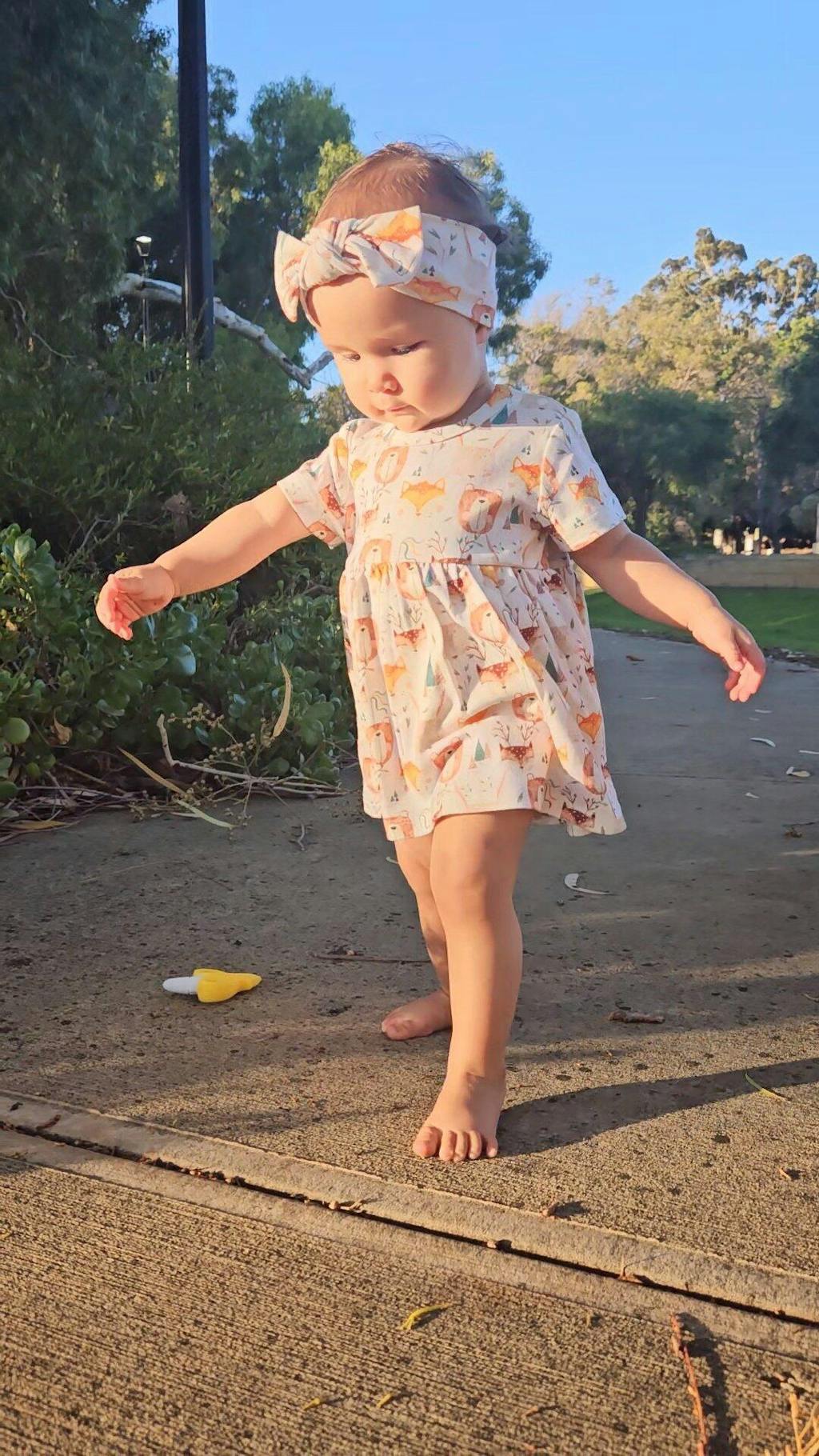 Baby girl wearing Wild Team organic safari dress onesie brand Duper DuDu design by a NICU nurse