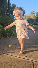 Baby girl wearing Wild Team organic safari dress onesie brand Duper DuDu design by a NICU nurse