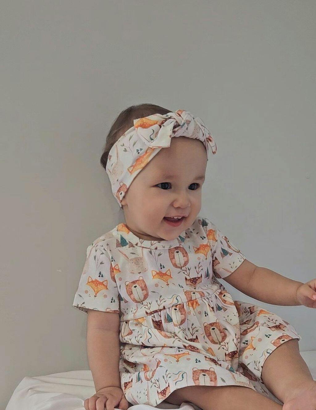 Baby girl wearing Wild Team organic safari dress onesie brand Duper DuDu design by a NICU nurse