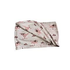 Soft organic cotton swaddle draped over nursery chair showing fox texture